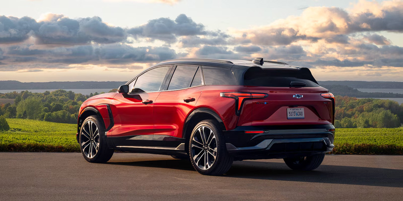 2026 Red Chevy Blazer EV parked on road on beautiful scenic view